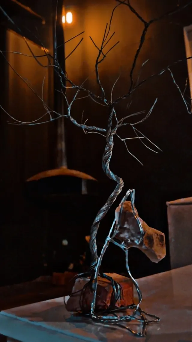 Tree growing from stone — wire sculpture by Pouya