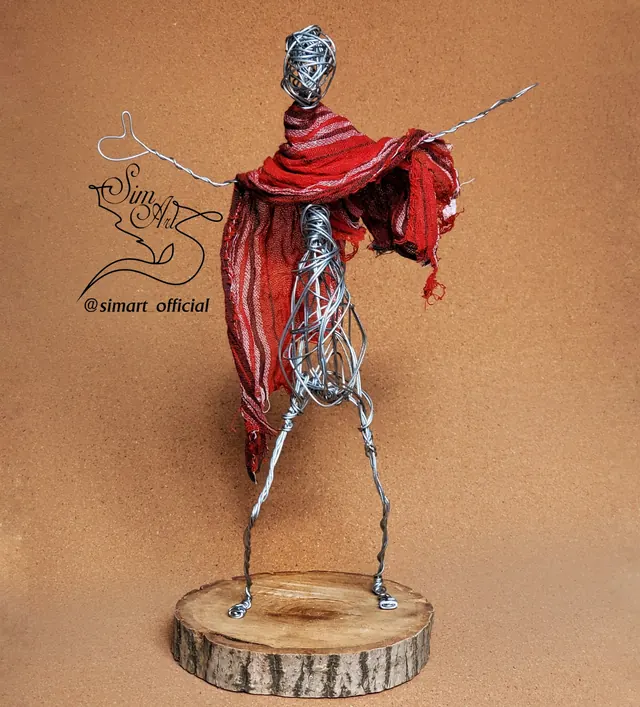 Figure in a red scarf — wire sculpture by Pouya