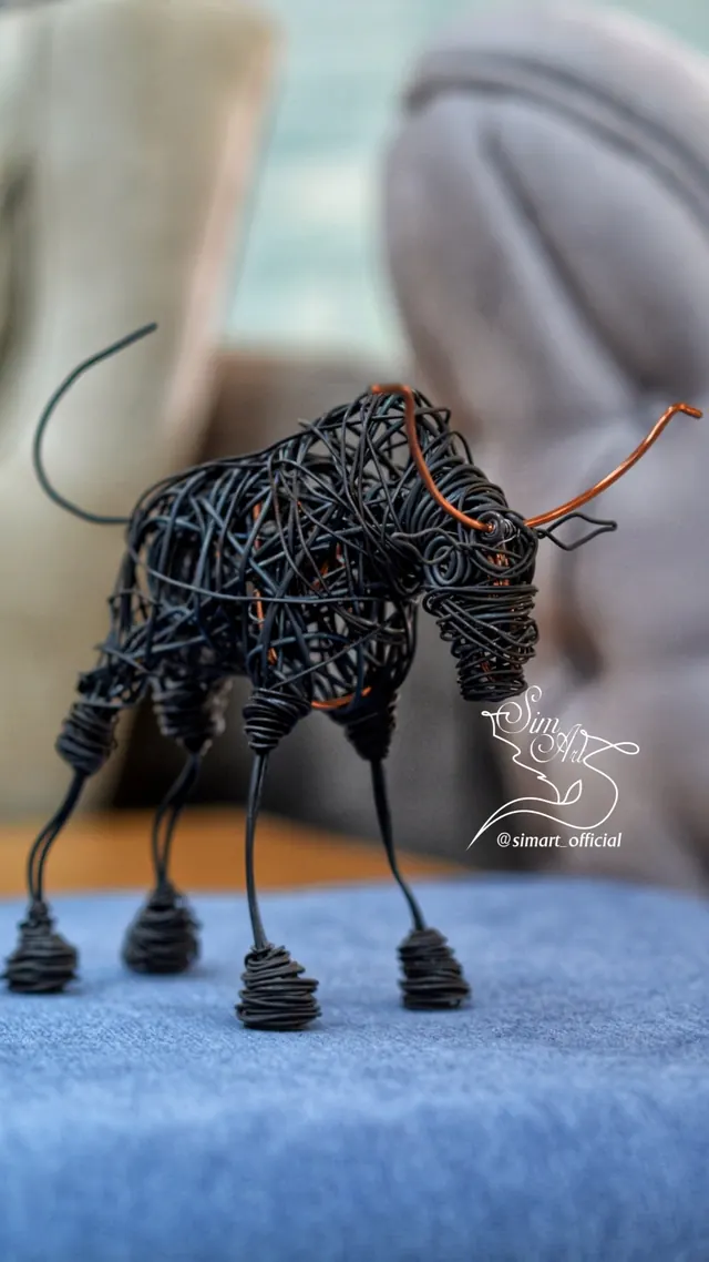 Bull with copper horns — wire sculpture by Pouya